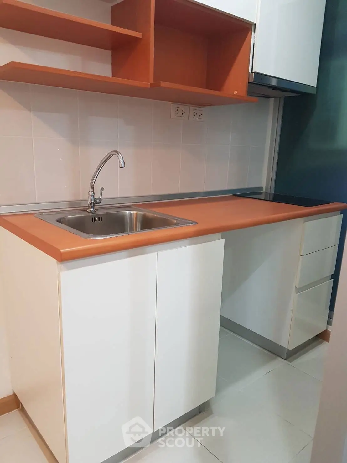 Modern kitchen with sleek cabinetry and stainless steel sink