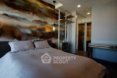 Luxurious bedroom with artistic wall design and modern lighting