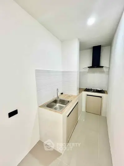 Modern minimalist kitchen with sleek design and gas stove
