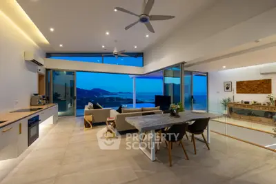 Luxurious open-plan living room with stunning ocean view and modern decor