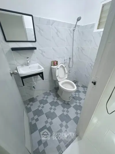 Modern bathroom with sleek tiles and open shower design
