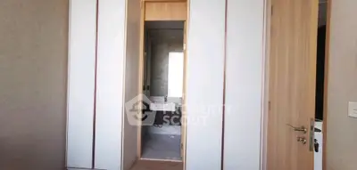 Modern bathroom with sleek design and wooden accents