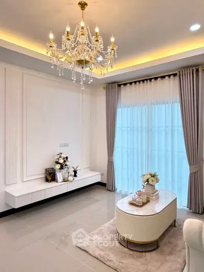 Elegant living room with chandelier and modern decor