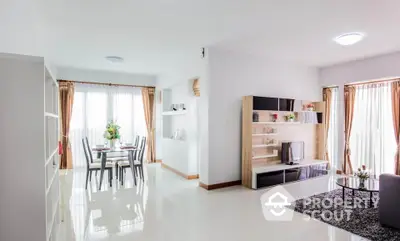 Spacious modern living room with dining area and natural light