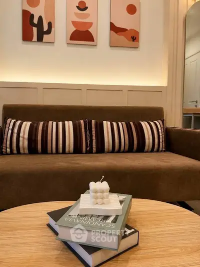 Stylish living room with modern decor and cozy seating area, perfect for relaxation and entertaining.
