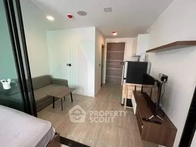 Modern compact living room with sleek furniture and open layout, perfect for urban living.