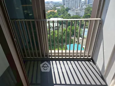 Charming balcony with city view, perfect for relaxation and enjoying the urban landscape.