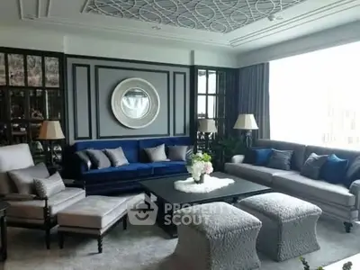 Luxurious living room with elegant decor and plush seating in a modern home.