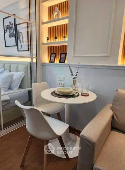 Modern cozy living space with stylish decor and intimate dining area