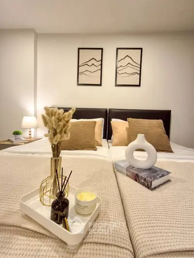 Cozy bedroom with elegant decor and soft lighting, perfect for relaxation.