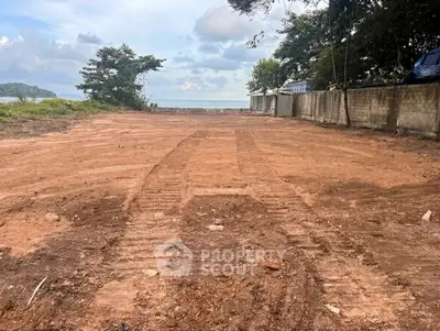 Prime beachfront land with ocean view, perfect for development opportunities.