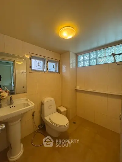 Spacious bathroom with modern fixtures and natural light
