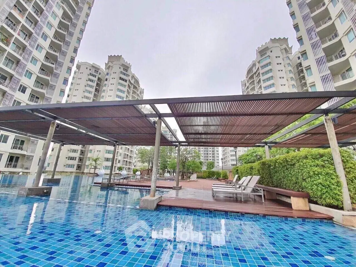 Luxurious apartment complex with stunning pool and modern architecture