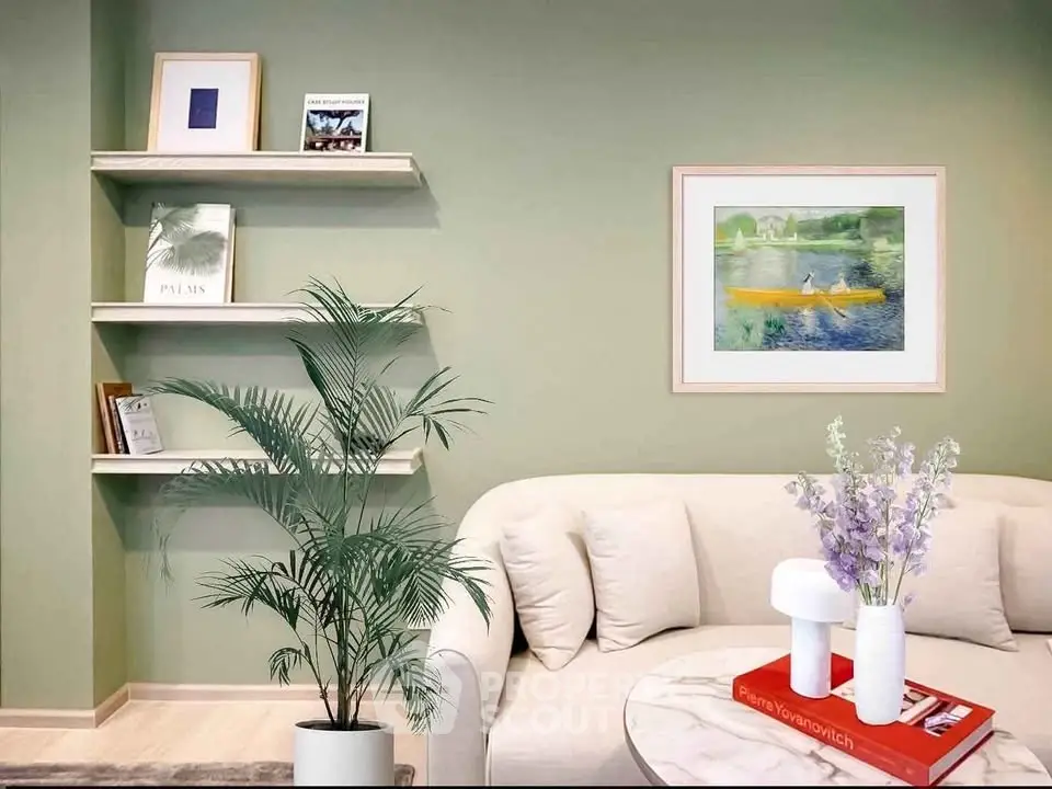 Stylish living room with modern decor, featuring a cozy sofa, elegant wall art, and chic shelving.