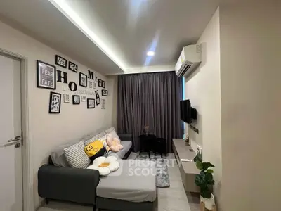 Cozy modern living room with stylish decor and comfortable seating in a well-lit apartment.