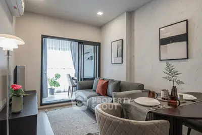 Modern living room with stylish decor and balcony access in a contemporary apartment.