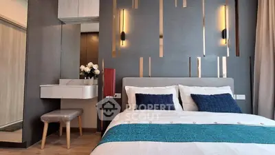 Modern bedroom with stylish decor and elegant lighting in a luxury apartment.