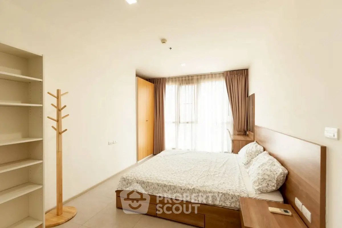 Spacious bedroom with modern furnishings and ample natural light