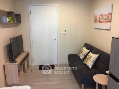 Cozy living room with modern decor and comfortable seating in a stylish apartment.
