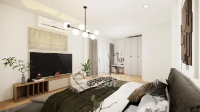 Modern bedroom with stylish decor, large TV, and elegant lighting in a cozy apartment.