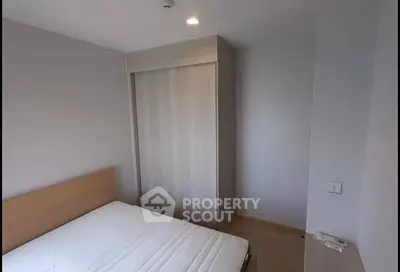 Cozy bedroom with minimalist design and built-in wardrobe