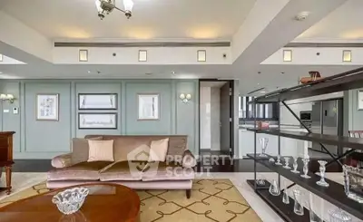 Luxurious living room with elegant decor and open kitchen layout in modern apartment.