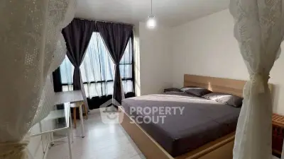 Cozy bedroom with modern furnishings and natural light