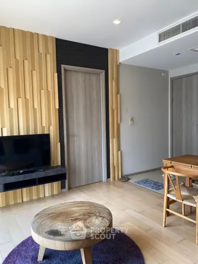 Modern living room with stylish wood paneling and cozy furniture