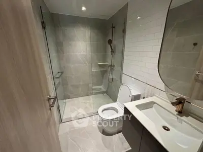 Modern bathroom with glass shower and sleek fixtures