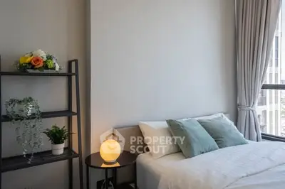 Modern bedroom with stylish decor and large window view