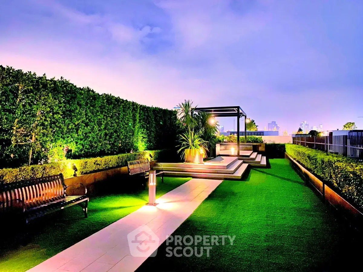 Luxurious rooftop garden with modern seating and lush greenery, perfect for relaxation and city views.
