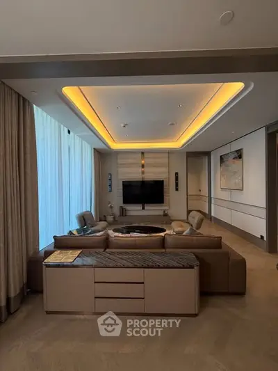 Luxurious living room with modern furniture and ambient lighting, perfect for relaxation and entertainment.