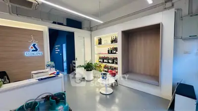 Modern office reception with sleek design and built-in shelving
