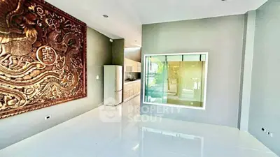 Modern interior with unique wall art and sleek kitchen design