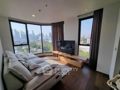 Luxurious living room with panoramic city views and modern furnishings