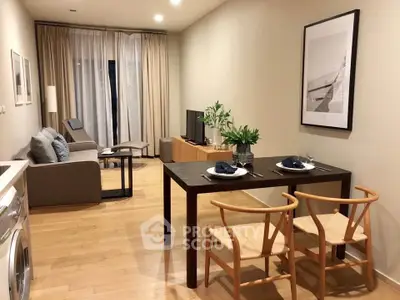 Modern living room with dining area, featuring stylish furniture and a cozy ambiance.