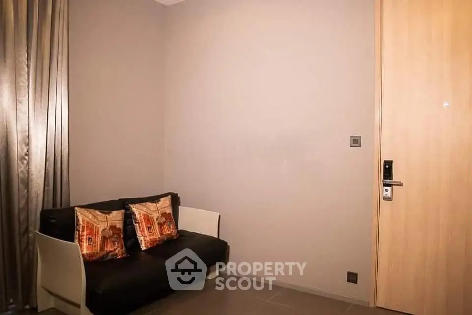 Cozy living room with modern sofa and elegant curtains, perfect for relaxation.