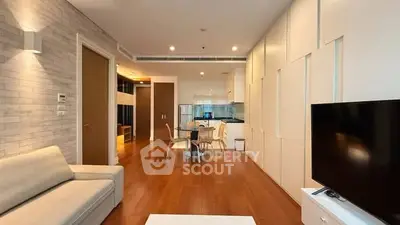 Spacious modern living room with open kitchen in a stylish apartment
