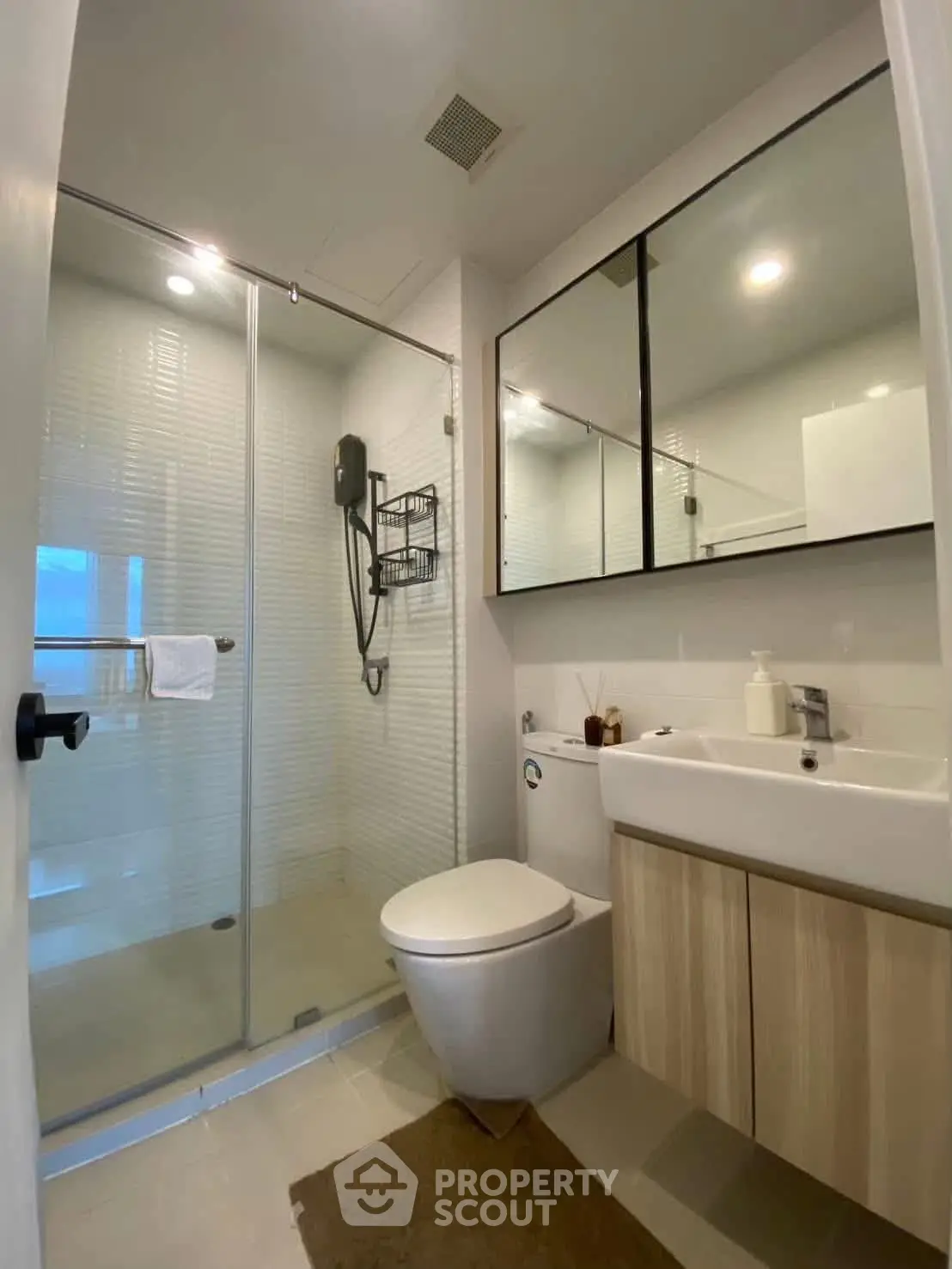 Modern bathroom with glass shower and sleek fixtures
