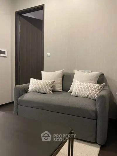 Cozy living room with modern gray sofa and stylish decor.