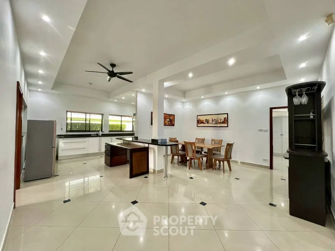 Spacious open-layout kitchen and dining area with modern fixtures and ample natural light.