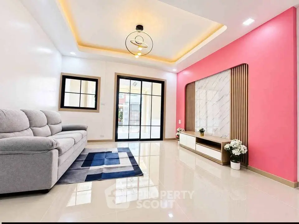 Modern living room with stylish decor and large windows for natural light.