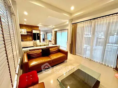 Spacious modern living room with large windows and elegant decor