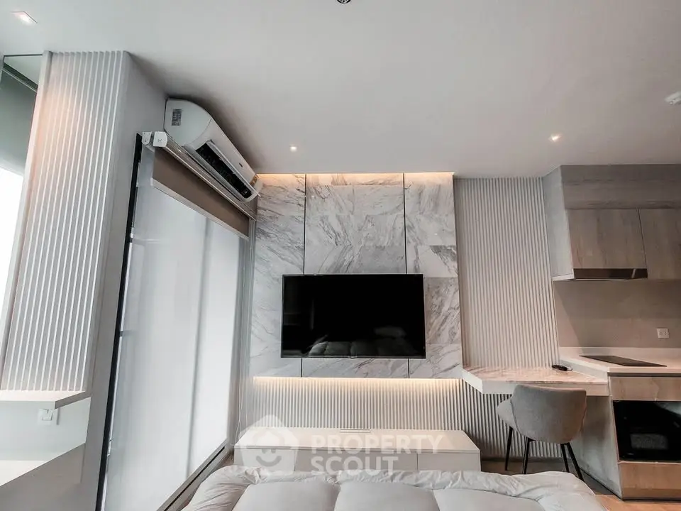 Modern living room with sleek design and wall-mounted TV