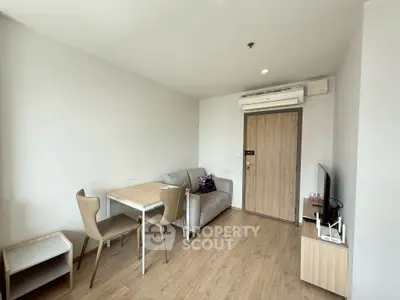 Modern living room with sleek furniture and air conditioning in a cozy apartment.