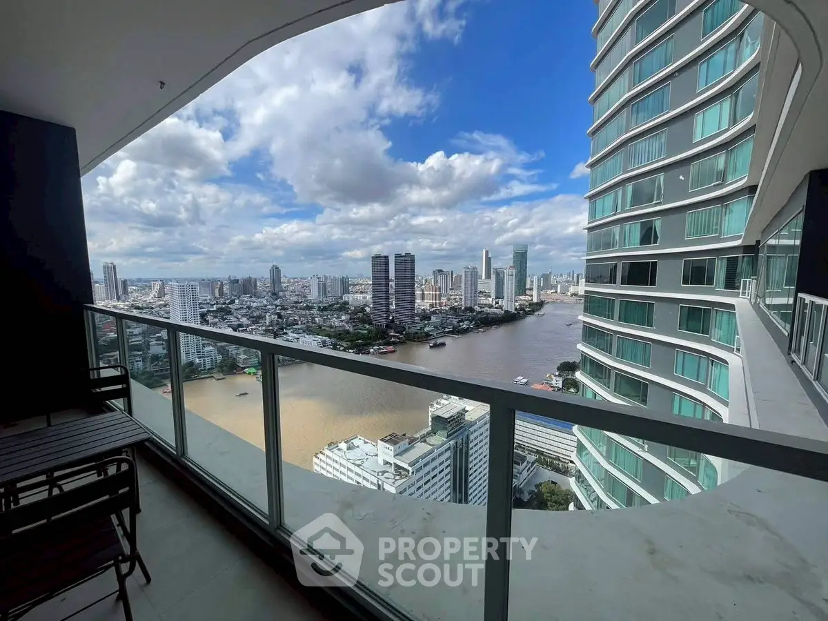 Stunning high-rise balcony view overlooking river and city skyline