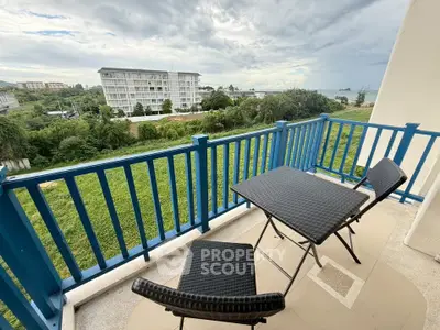 Charming balcony with ocean view, perfect for relaxation and enjoying the serene surroundings.