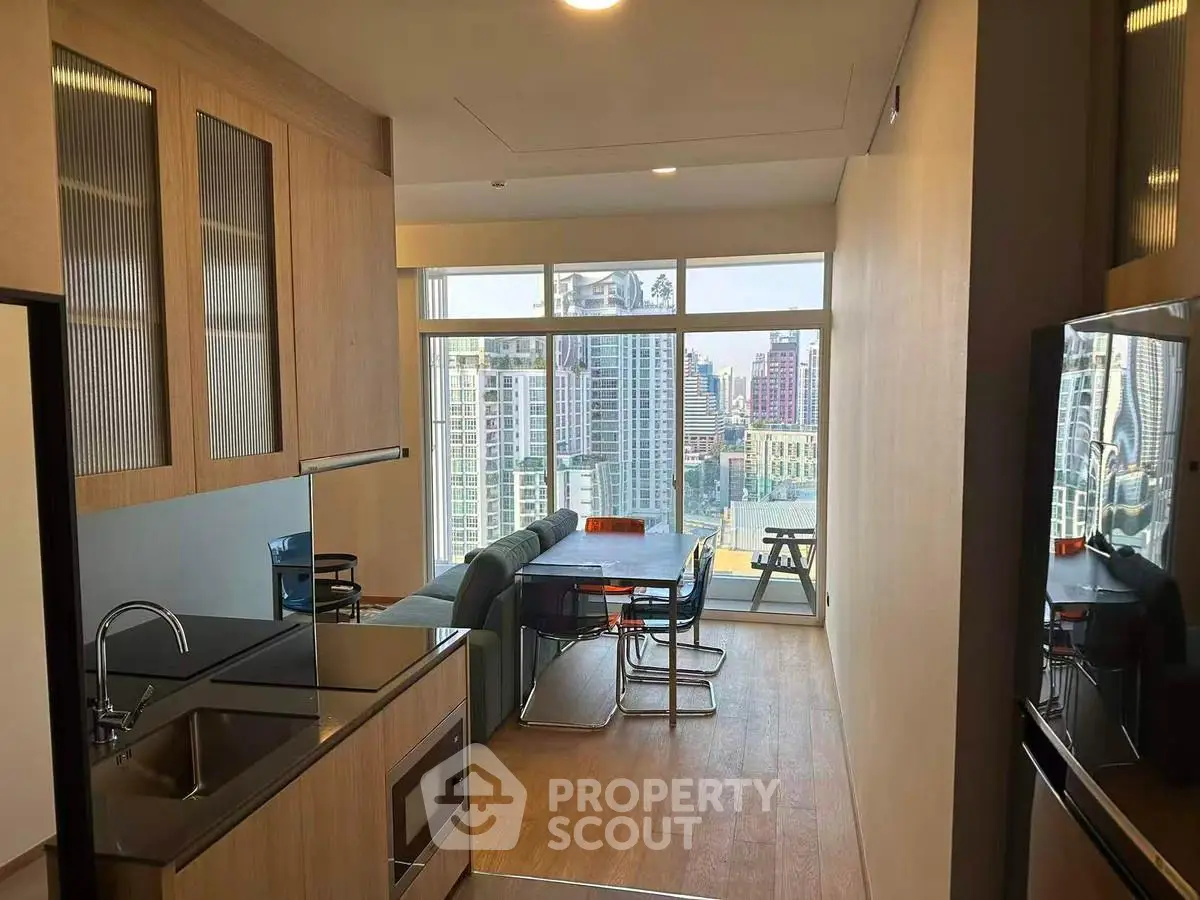 Modern apartment with open kitchen and stunning city view from the living room.