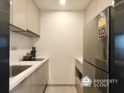 Modern kitchen with sleek cabinetry and stainless steel appliances