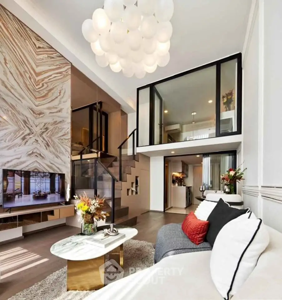 Luxurious modern living room with high ceiling and stylish mezzanine, featuring elegant decor and ample natural light.